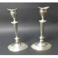 A matched pair of George V silver candlesticks, with removable inserts and weighted bases, D & M Dav... 