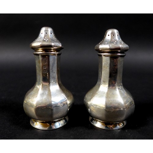 22 - A group of Edwardian and later silver pepper pots and salts, including a pair of pepper pots, possib... 
