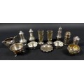 A group of Edwardian and later silver pepper pots and salts, including a pair of pepper pots, possib... 