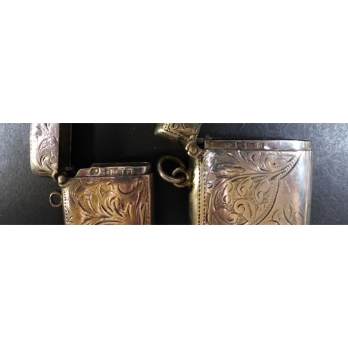 26 - A collection of seven Victorian and later silver vesta cases, including a Victorian vesta case beari... 