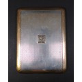 An Asprey George V silver and yellow metal cigarette case, mounted initials to the front 'GB', engin... 