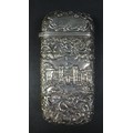 A Victorian silver 'castle top' cigar case, by Nathaniel Mills, with repoussé embossed castle images... 