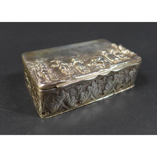 41 - A Victorian silver box, the hinged cover embossed with a village scene depicting five standing figur... 