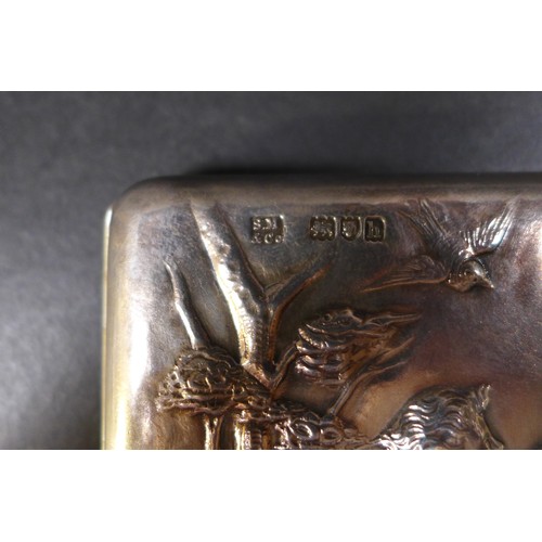 54 - An Edward VII silver card case or purse by Sampson Mordan, the front with embossed with two putti in... 