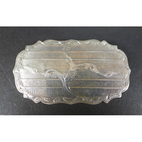20 - A Victorian silver case, of oval form with scalloped rim and hinged cover, engraved foliate decorati... 
