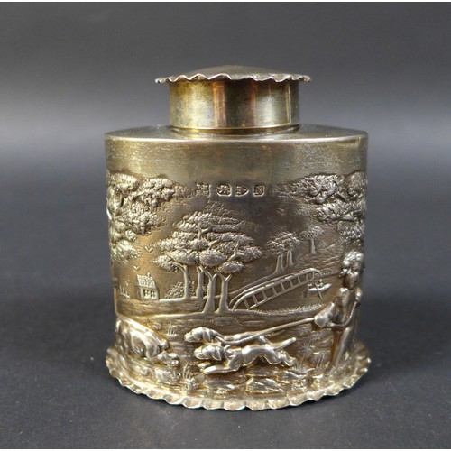 39 - A Victorian silver canister, of oval section, the cover and foot with crimped rim, the sides embosse... 