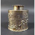 A Victorian silver canister, of oval section, the cover and foot with crimped rim, the sides embosse... 
