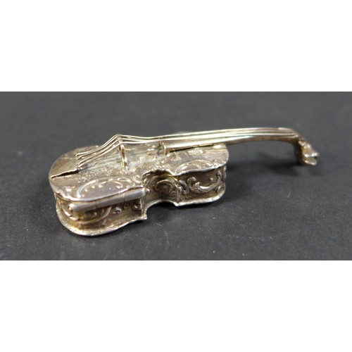 19 - A late 19th century Hanau silver novelty box, in the form of a violin, with embossed decoration of m... 