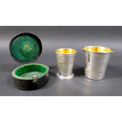 10 - Two Victorian silver collapsible cups with gilt washed interiors, a three section cup, with armorial... 