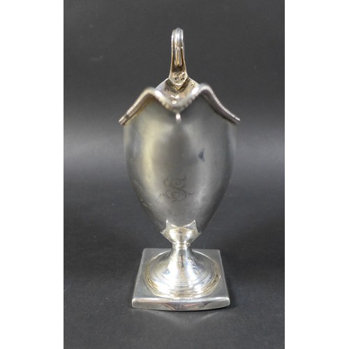 35 - A group of silver items, including a Georgian silver helmet shaped cream jug, 14.5cm high, ovoid sha... 