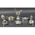 A group of silver items, including a Georgian silver helmet shaped cream jug, 14.5cm high, ovoid sha... 