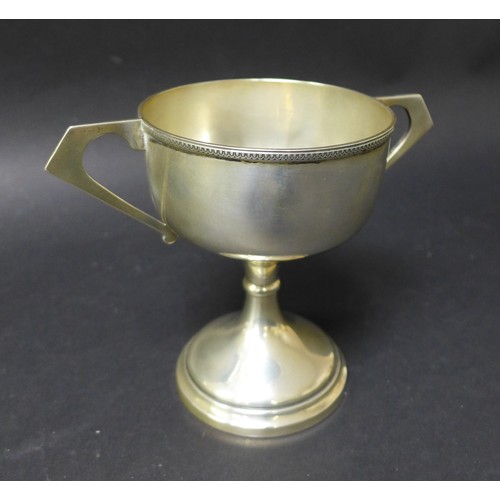 23 - A George V twin handled trophy cup, G Bryan & Co. Birmingham, possibly 1913, 6toz, 16.5 by 10 by 13.... 