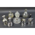 A group of four silver topped cut glass dressing table bottles, largest 14cm high, a silver matchbox... 