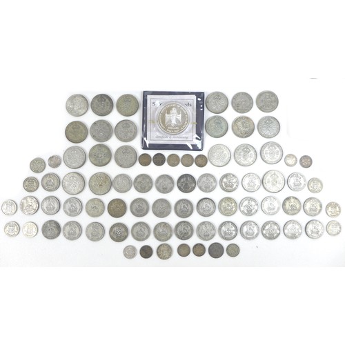 73 - A collection of Victorian and later coinage, including a Victorian two shilling coin, a Royal Mint E... 