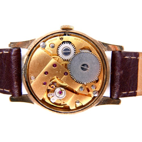 111 - A Garrard 9ct gold cased gentleman's wristwatch, on brown leather strap, presentation engraved verso... 