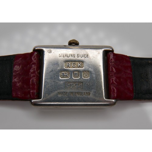 97 - A Roy King silver cased gentleman's wristwatch, with white square dial, on a red strap, 23.5mm case.