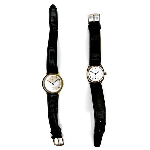 95 - Two vintage gold plated gentleman's wristwatches, comprising a Limit with circular dial, on black st... 