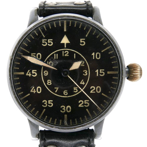 A German WWII Luftwaffe Type B Observers Watch or Beobachtungsuhr (B-Uhr), signed Laco, 22 Steine, circa 1945, manual wind, nickel case, the radium luminous black dial with Arabic five-minute numerals and batons with arrow at 12 o'clock, a central inner ring with Arabic numerals 1 to 12, sweeping centre seconds, ordinance number FL23883 stamped to the side, movement number H3285 to back cover and 03285 to the movement, inside caseback marked 'Beobachtungsuhr Bauart: Durowe, Gerat-Nr. 127-560B, Werk-Nr. H 3285, Anforderz. FL23883, Hersteller: Lacher & Co', dial 50mm, 54.7mm case, 63.6mm across crown, 26mm between lugs, 171.7g gross, on a later black hand-stitched leather strap, but with the replaced older brown leather strap.
Notes: In working condition, winds and hand sets well, runs across 30min test, however Batemans cannot guarantee its continued operation.