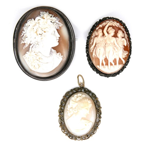 180 - A group of three cameo brooches, comprising a 19th century example carved with three classical ladie... 