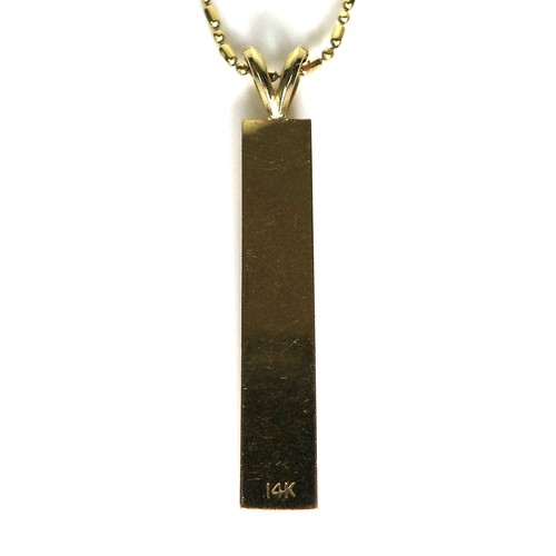 215 - A 14ct gold pendant and chain necklace, engraved with a plumeria flower and inscribed with the Hawai... 