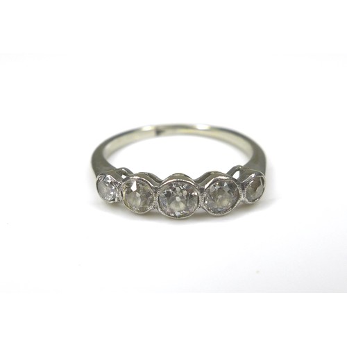 243 - A five-stone diamond and white metal ring, size H/I, 1.9g.