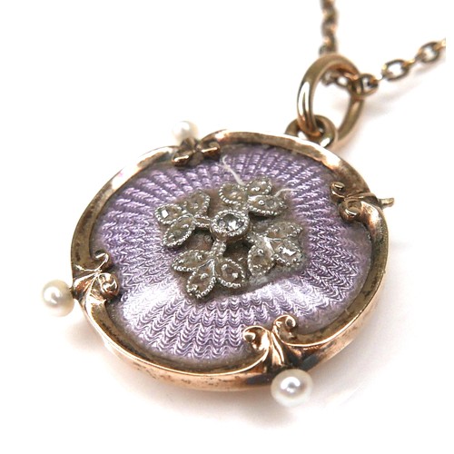 244 - A 15ct gold pendant with enamel and seed pearls, 2.2cm diameter, missing one seed pearl, with 9ct go... 