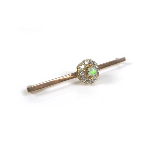 245 - A 9ct gold opal and diamond bar brooch, 3.1g, 4.5 by 1cm.