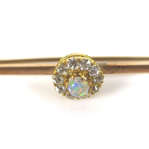 245 - A 9ct gold opal and diamond bar brooch, 3.1g, 4.5 by 1cm.