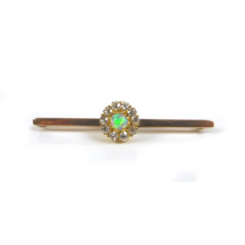 245 - A 9ct gold opal and diamond bar brooch, 3.1g, 4.5 by 1cm.