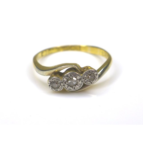 237 - An 18ct gold three stone diamond ring, size L, 2.2g, together with a 9ct gold crucifix, 4.1g. (2)