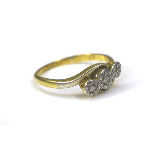 237 - An 18ct gold three stone diamond ring, size L, 2.2g, together with a 9ct gold crucifix, 4.1g. (2)