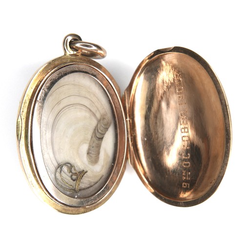 240 - A yellow metal and seed pearl Victorian mourning pendant, with a lock of hair enclosed, 12.8g.