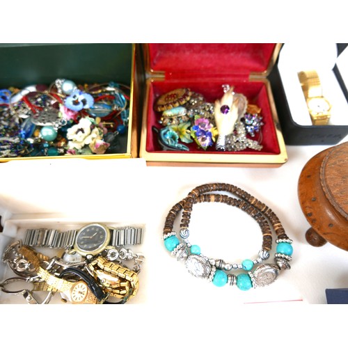 142 - A collection of costume jewellery and wristwatches, together with a number of coins and a WWI victor... 