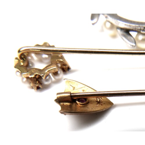 159 - Two pearl mounted stick pins, comprising a 9ct gold ruby and pearl stick pin, 0.8g, a yellow metal g... 