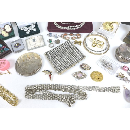 141 - A collection of costume Jewellery including some silver, bangles, brooches, necklaces, and some ring... 