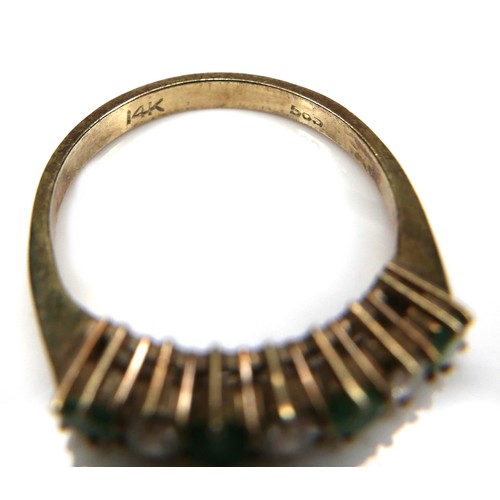 190 - An emerald and diamond ring, the four round cut emeralds, 2mm in diameter, the three round cut diamo... 