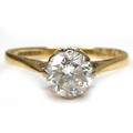 An 18ct yellow gold diamond solitaire ring, the round brilliant cut stone, 6.0 by 3.5mm, approximate... 