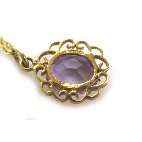 223 - Two 9ct gold pendant necklaces, comprising an amethyst pendant with 9t gold mount and yellow metal c... 