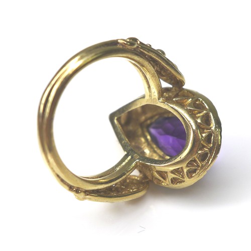 226 - An amethyst and seed pearl 9ct gold dress ring, pear cut amethyst 8 by 14mm, encircled by seed pearl... 