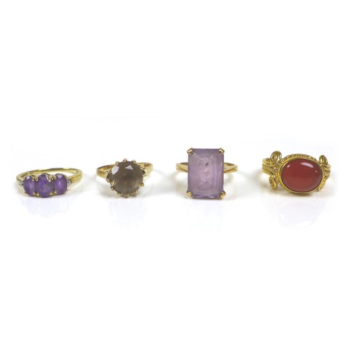 175 - Three 9ct gold dress rings, comprising an pale amethyst style ring, its rectangular stone 14 by 10mm... 