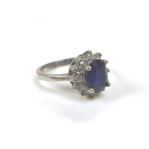 218 - Five dress silver and gem stone dress rings, comprising a blue sapphire and white stone ring, oval c... 