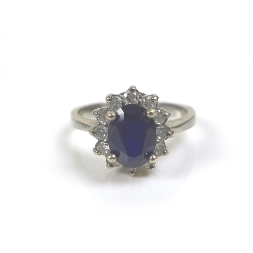 218 - Five dress silver and gem stone dress rings, comprising a blue sapphire and white stone ring, oval c... 