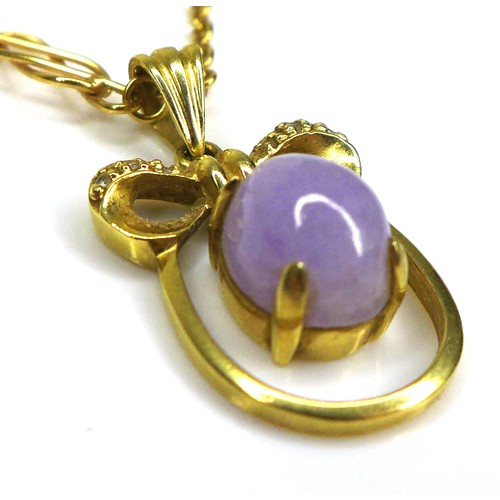 272 - An 18k yellow gold pendant necklace, of oval form with a bow surmount centered by a lavender coloure... 