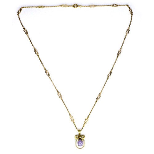 272 - An 18k yellow gold pendant necklace, of oval form with a bow surmount centered by a lavender coloure... 