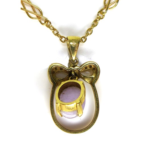 272 - An 18k yellow gold pendant necklace, of oval form with a bow surmount centered by a lavender coloure... 