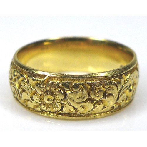 270 - A George V 18ct yellow gold wedding band ring, with engraved floral decoration, T&S, Chester 1926, 6... 