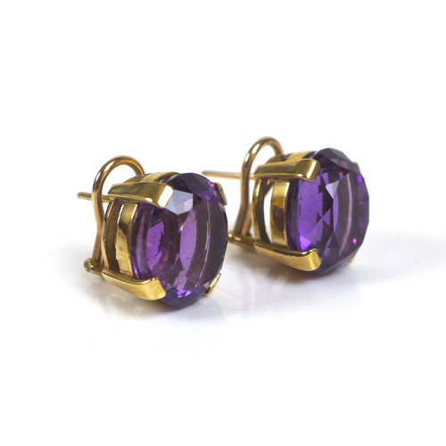 254 - A pair of 9ct gold mounted amethyst clip-on earrings, the oval cut amethysts, each approximately 12 ... 