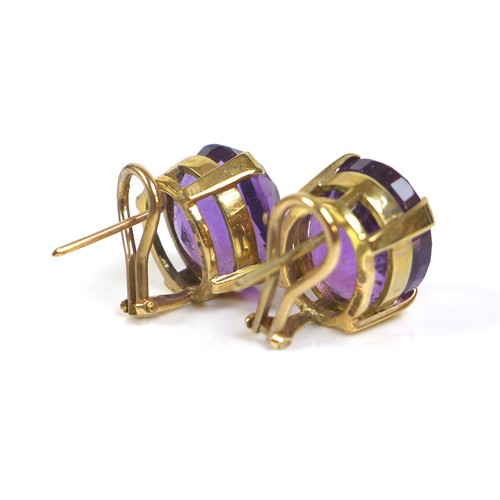 254 - A pair of 9ct gold mounted amethyst clip-on earrings, the oval cut amethysts, each approximately 12 ... 