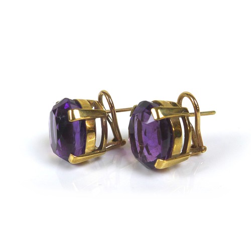 254 - A pair of 9ct gold mounted amethyst clip-on earrings, the oval cut amethysts, each approximately 12 ... 