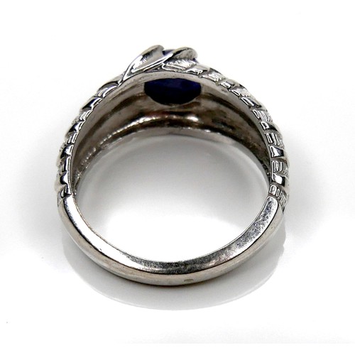 258 - A 14K white gold ring set with a star sapphire, 3.5 by 6.0mm, size S, 6.2g.